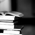 Black and white image of a pile of books
