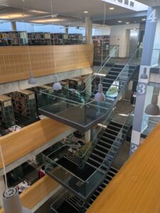 View of building interior with staircases leading to different levels.