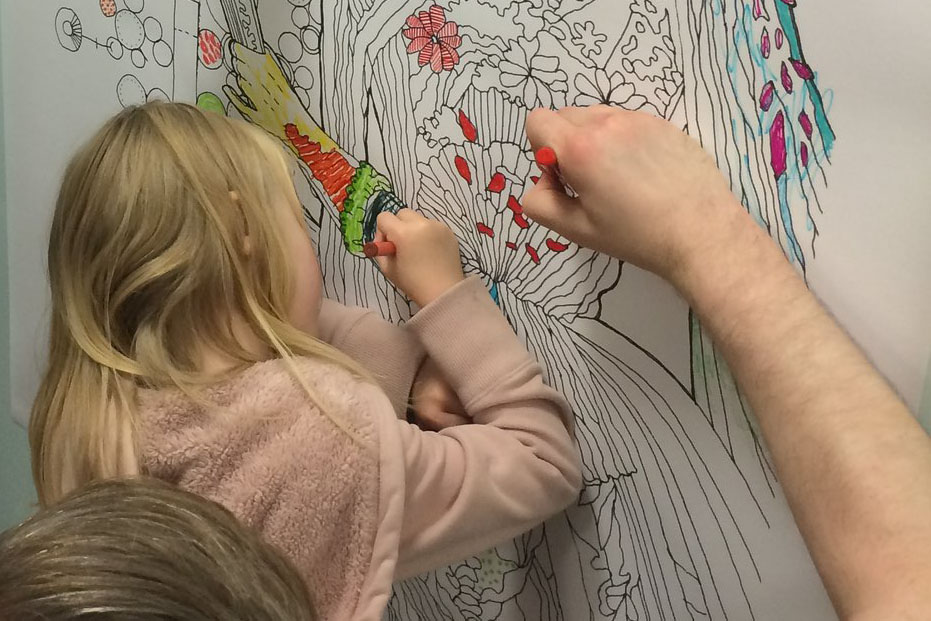 Young girl colouring-in an illustration of Ada Lovelace.
