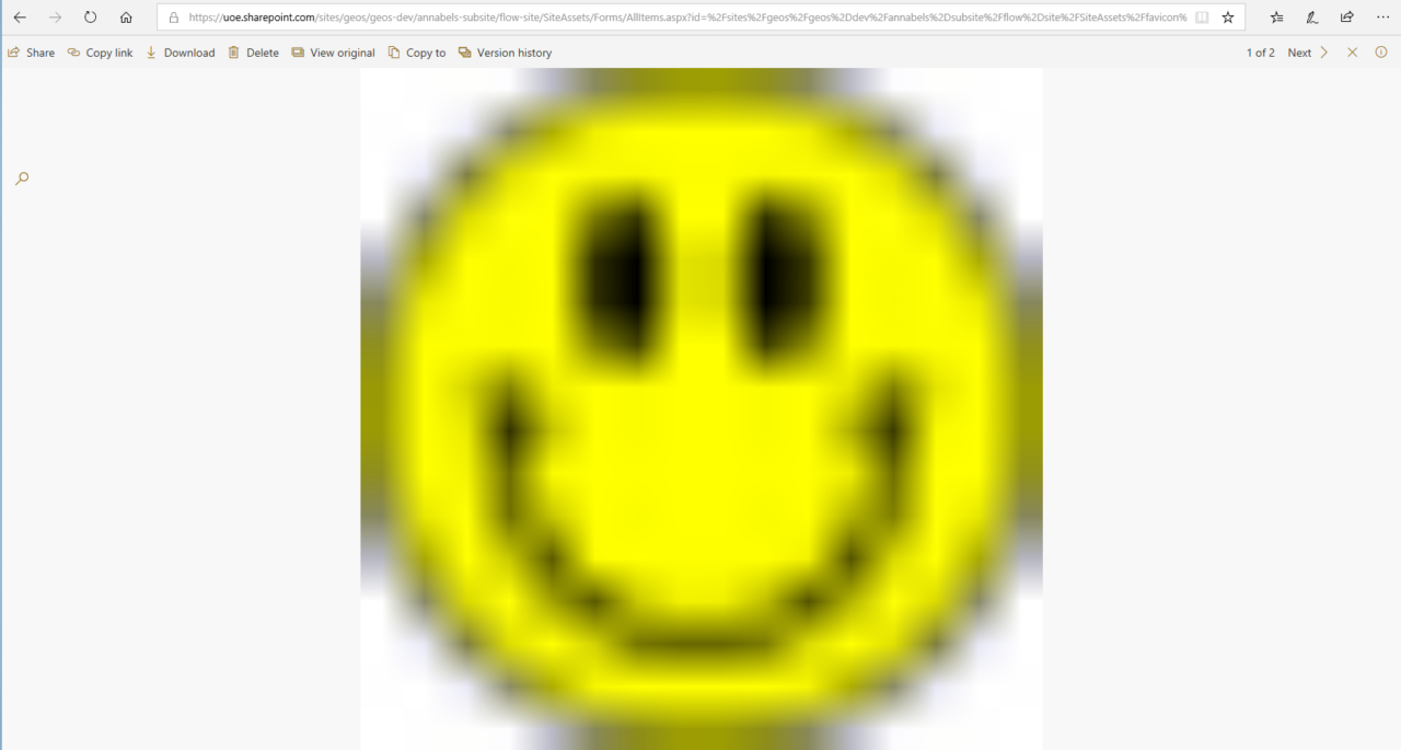 Browser window screenshot showing and enormous blurry smiley icon
