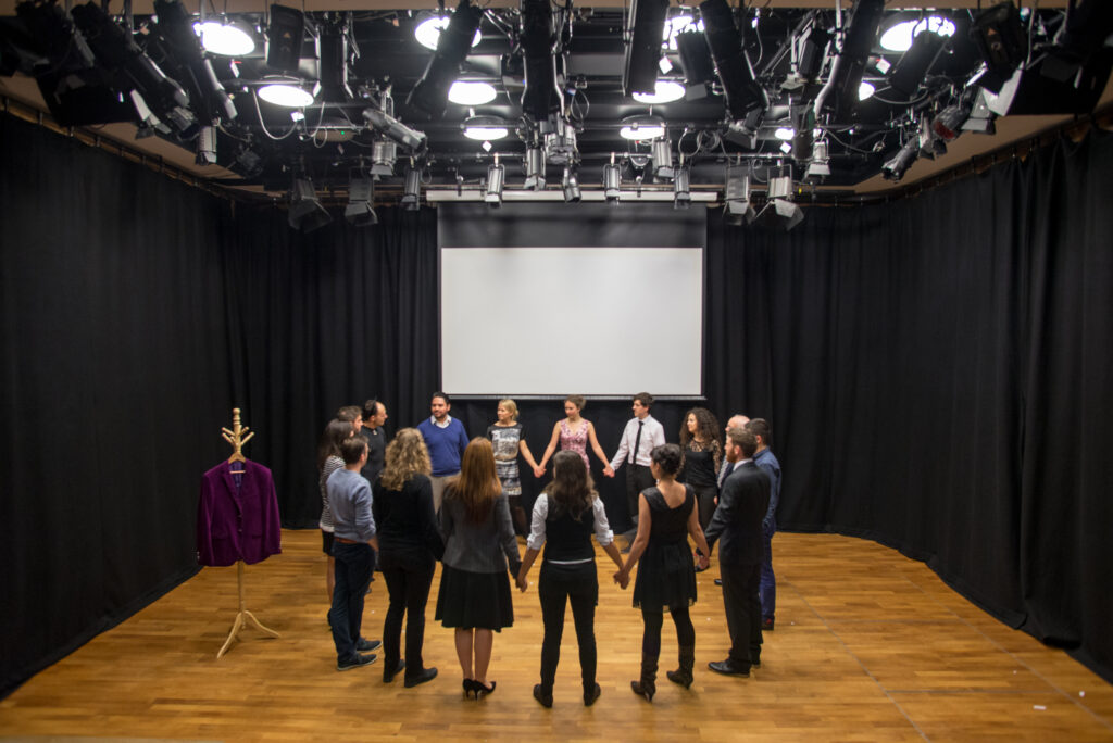 A group of artists and researchers on stage