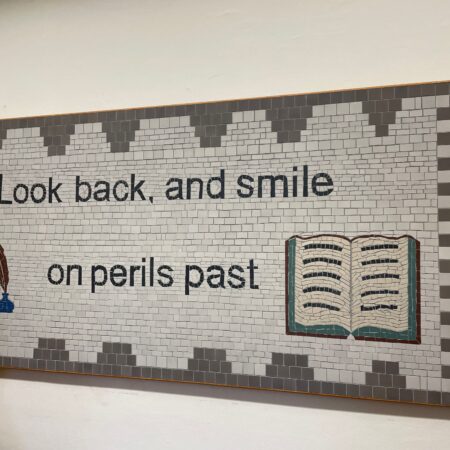Tiled piece sayin g"Look back and smile on perils past" taken at Abbotsford, home of Walter Scott