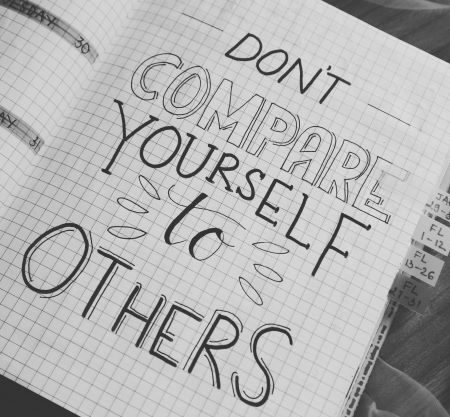 Don't compare yourself to others written on notepad