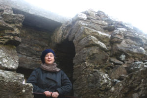 Kate Mathis stands in Muness Castle, Unst, Shetland.