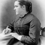 Sophia Jex Blake as a young woman, writing at her desk
