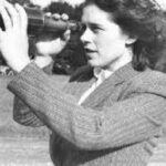 Mary Brück looks through a telescope