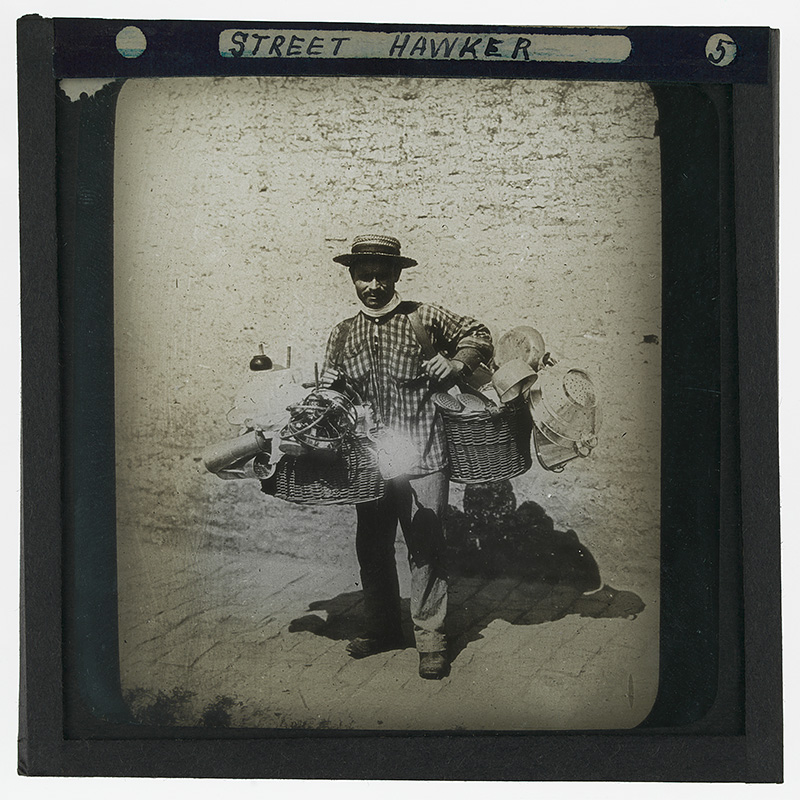 'Street Hawker in Buenos Aires'. Photograph of a street hawker selling strainers, pots and pans in Buenos Aires, Argentina in the late 19th or early 20th century.
