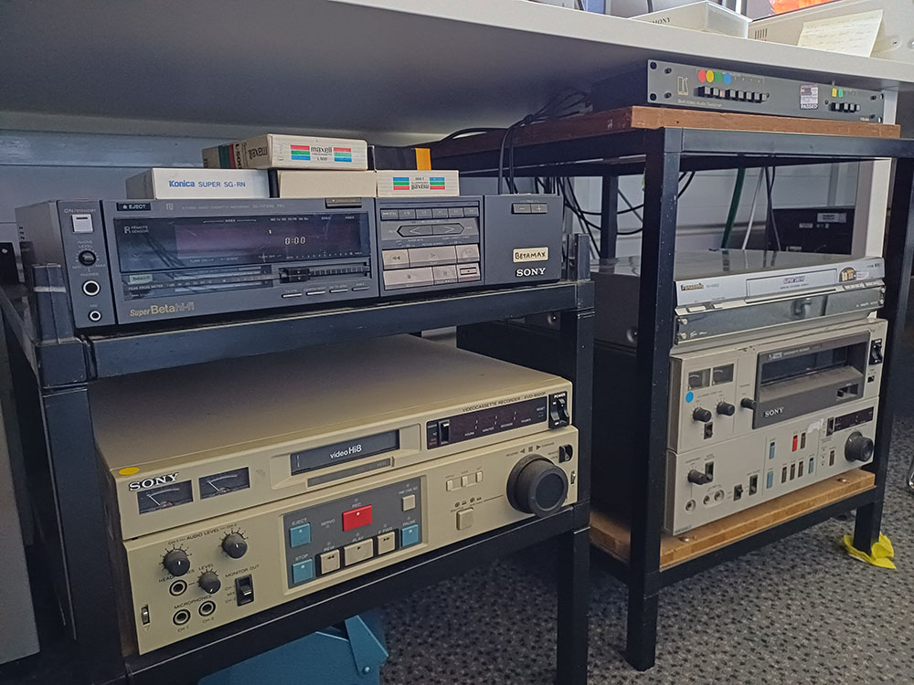 Video digitisation station featuring Betamax, Hi-8, VHS, and U-matic playback equipment. 