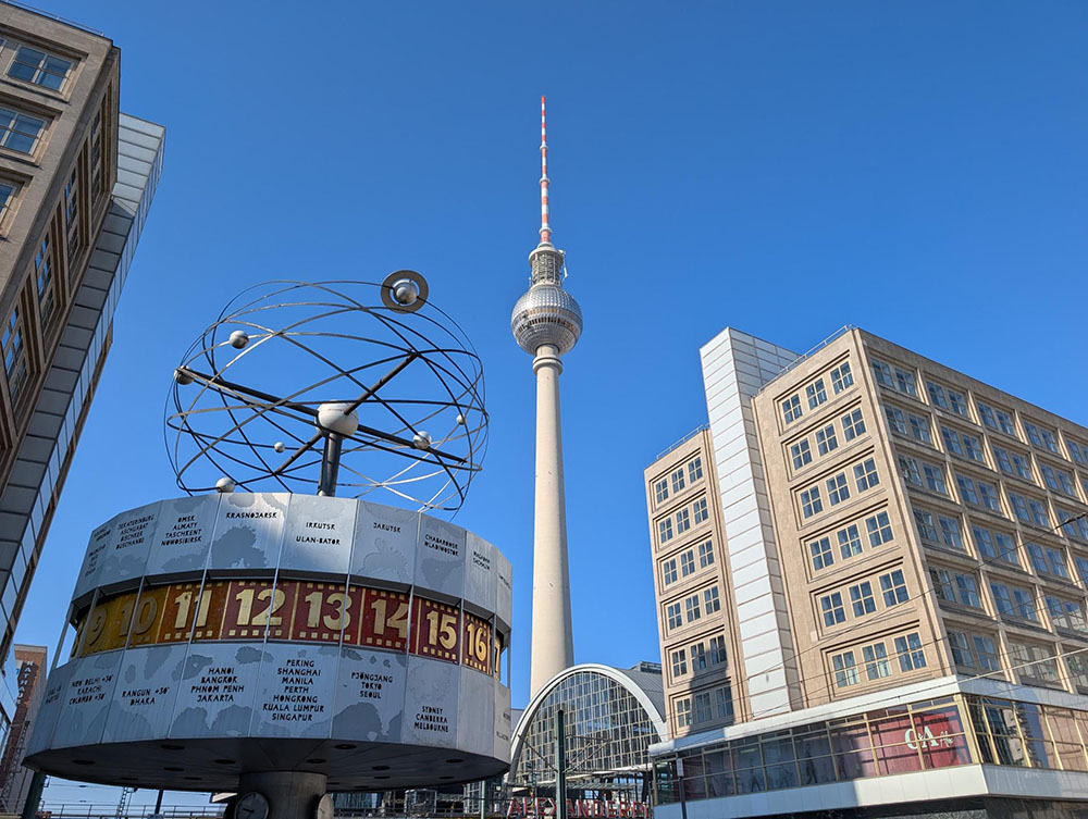 View of the World Clock and Television Tower (known as the Fernsehturm) at Alexanderplatz in Berlin
