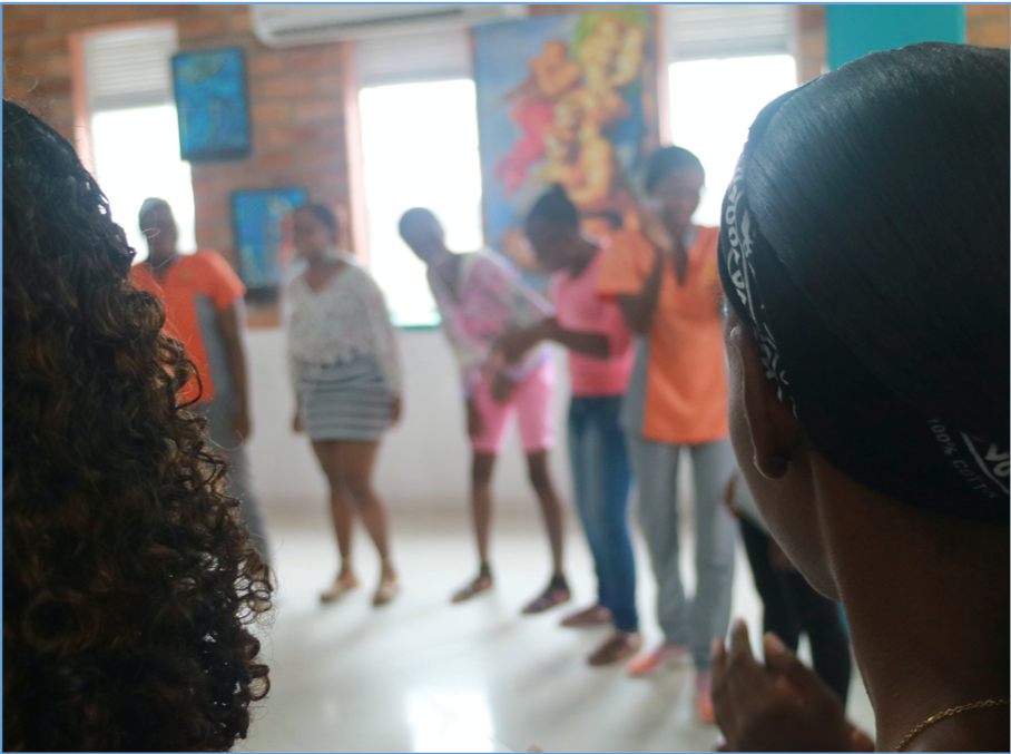 A group of young women take part in a (pre-pandemic) arts- and music-based workshop in Quibdó.