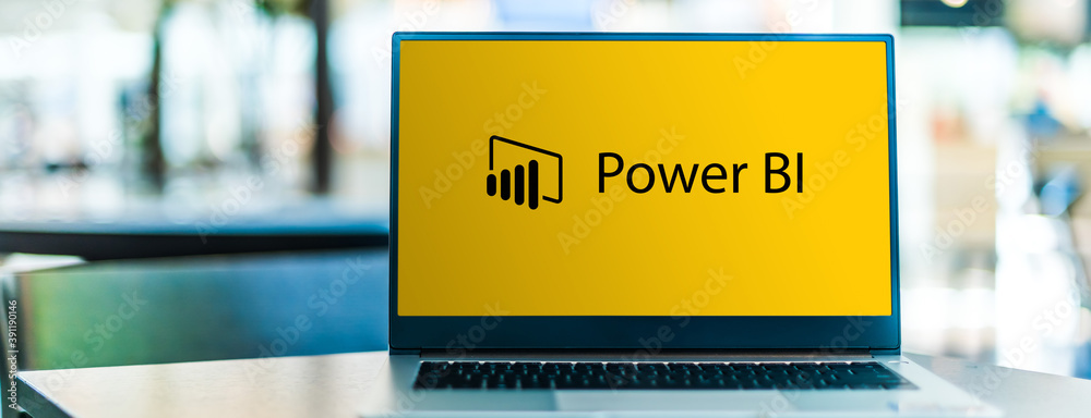 Picture with laptop displaying PowerBI