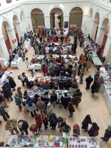 A view from above of the bookfair taking place in the Sculpture Court