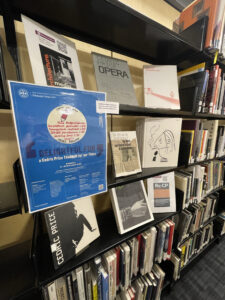 Some book shelves with a display of books about Cedric Price