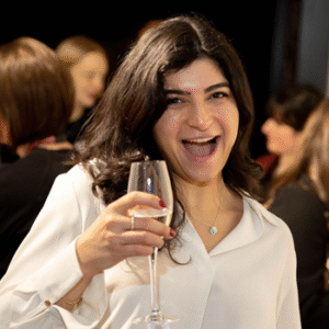 Portrait of Mona holding a glass