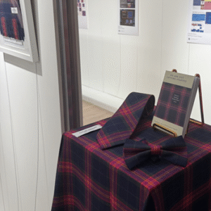 Tartan items on display on a table in the exhibition