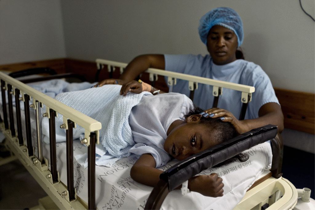 Girl lying down in hospital bed