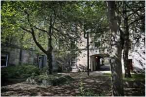 image of old building courtyard with trees