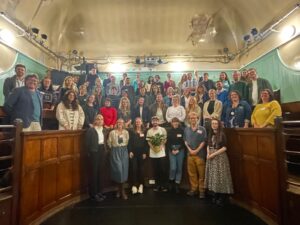 people facing camera in victorian lecture theatre