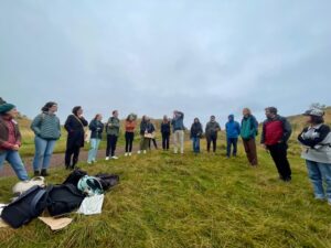 group of people standing in circle outdoors