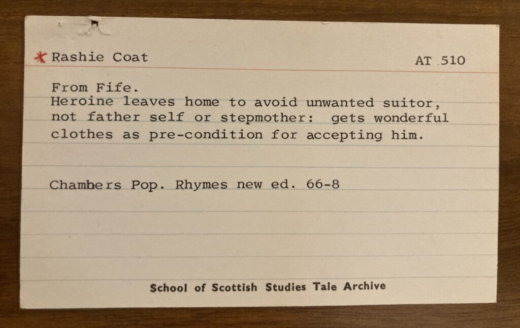 card reads "Rashie Coat, from Fife. Heroine leave home to avoid unwanted suitor, not father, self or stepmother; gets wonderful clothes as pre-condition for accepting him"