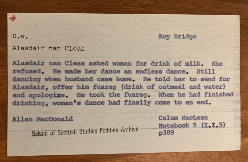 card reads: Alasdair nan cleas asked woman for drink of milk. She refused. He made her dance an endless dance. Still dancing when husband came home. He told her to send for Alasdair, offer him a drink of oatmeal and water and apologise. when finished drinking, woman's dance finally came to an end