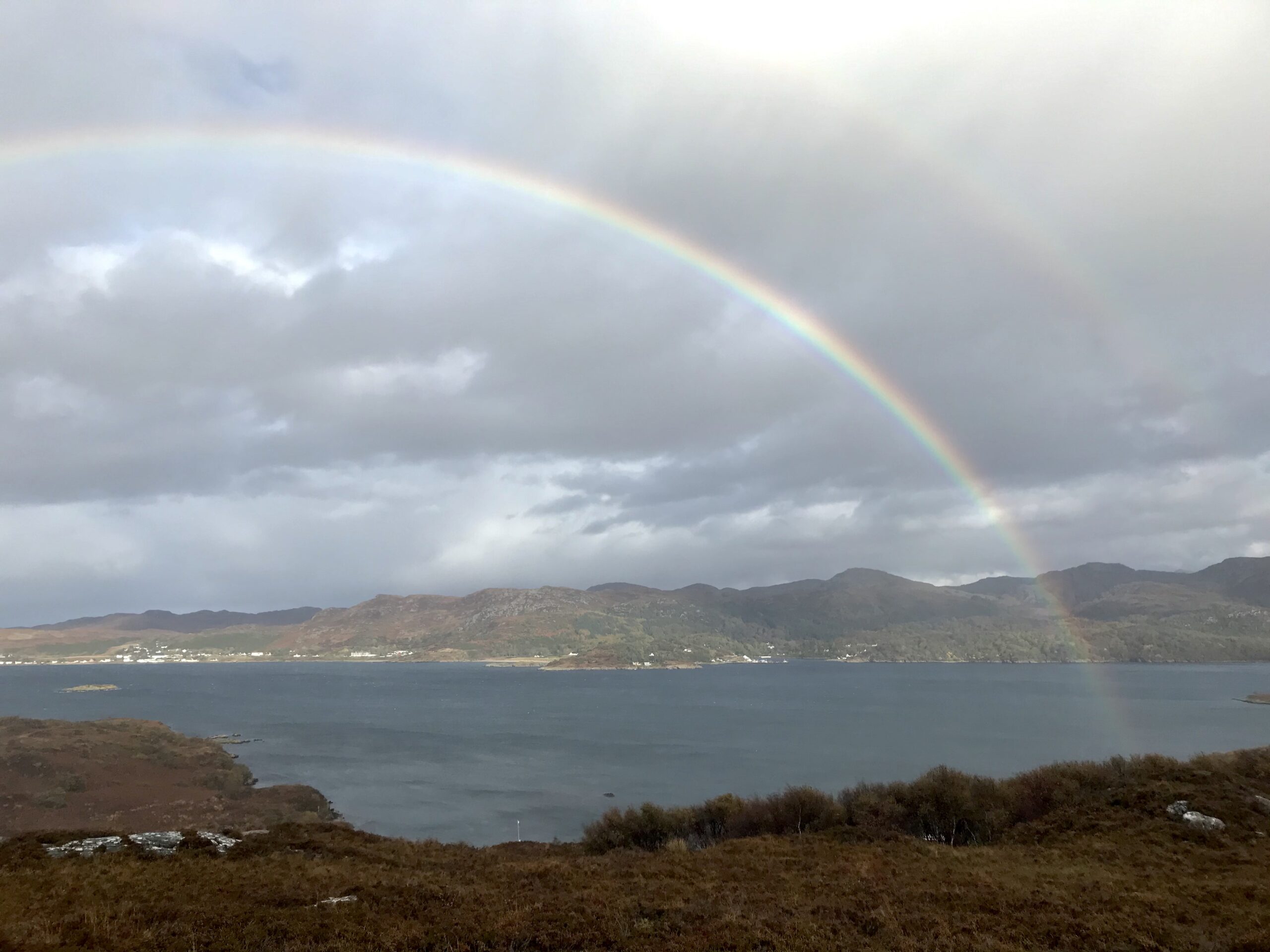 Double rainbow framing a view over Gairloch