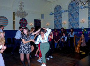 People dancing at an annual Ceilidh ball.