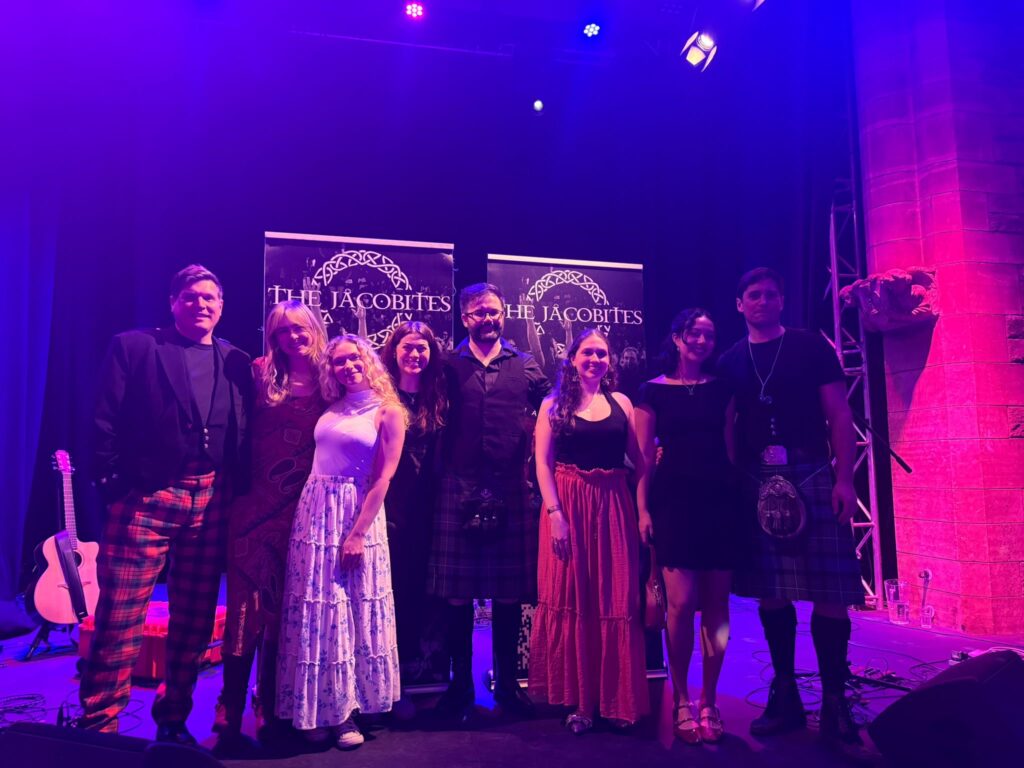 A group of people posing for a photo at the GeoSciences Ceilidh event