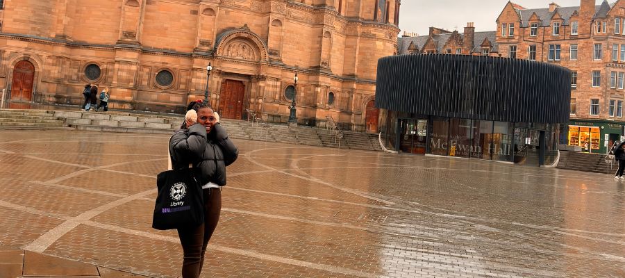 Jeannette standing in front of McEwan Hall at Bristo Square