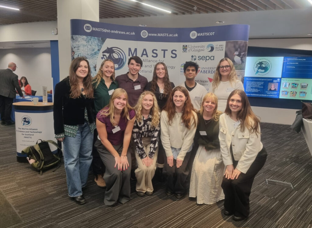 A group of people posing for a photo at the MASTS conference