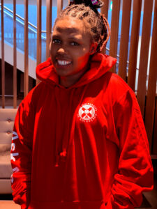 Jeannette wearing a red student ambassador hoodie