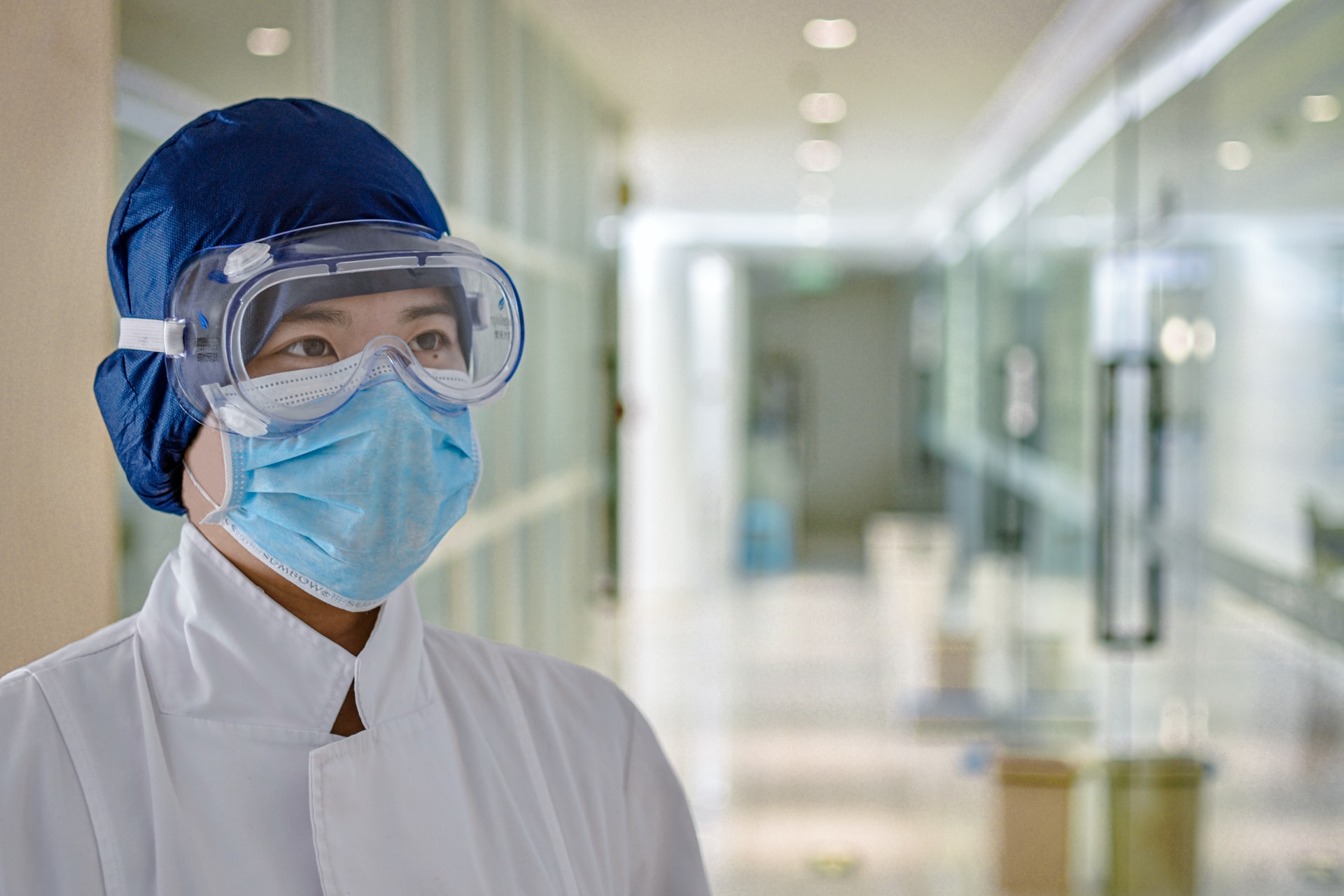 Medical person in protective clothing standing in hospital