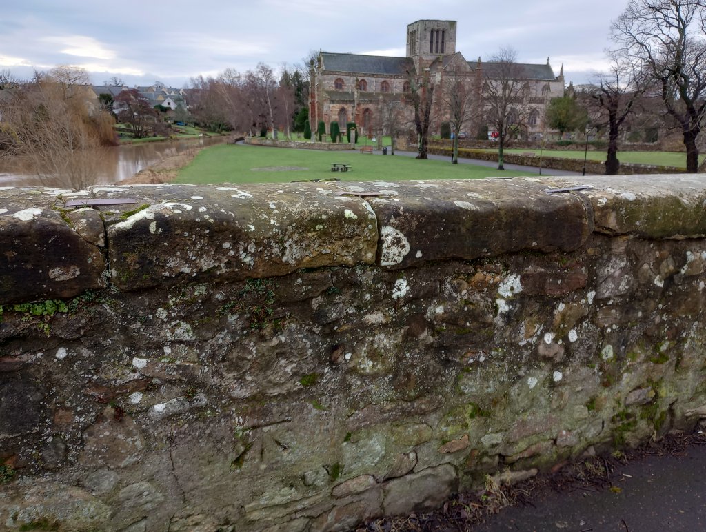 Cutmark on bridge parapet with St. Mary's Kirk in background