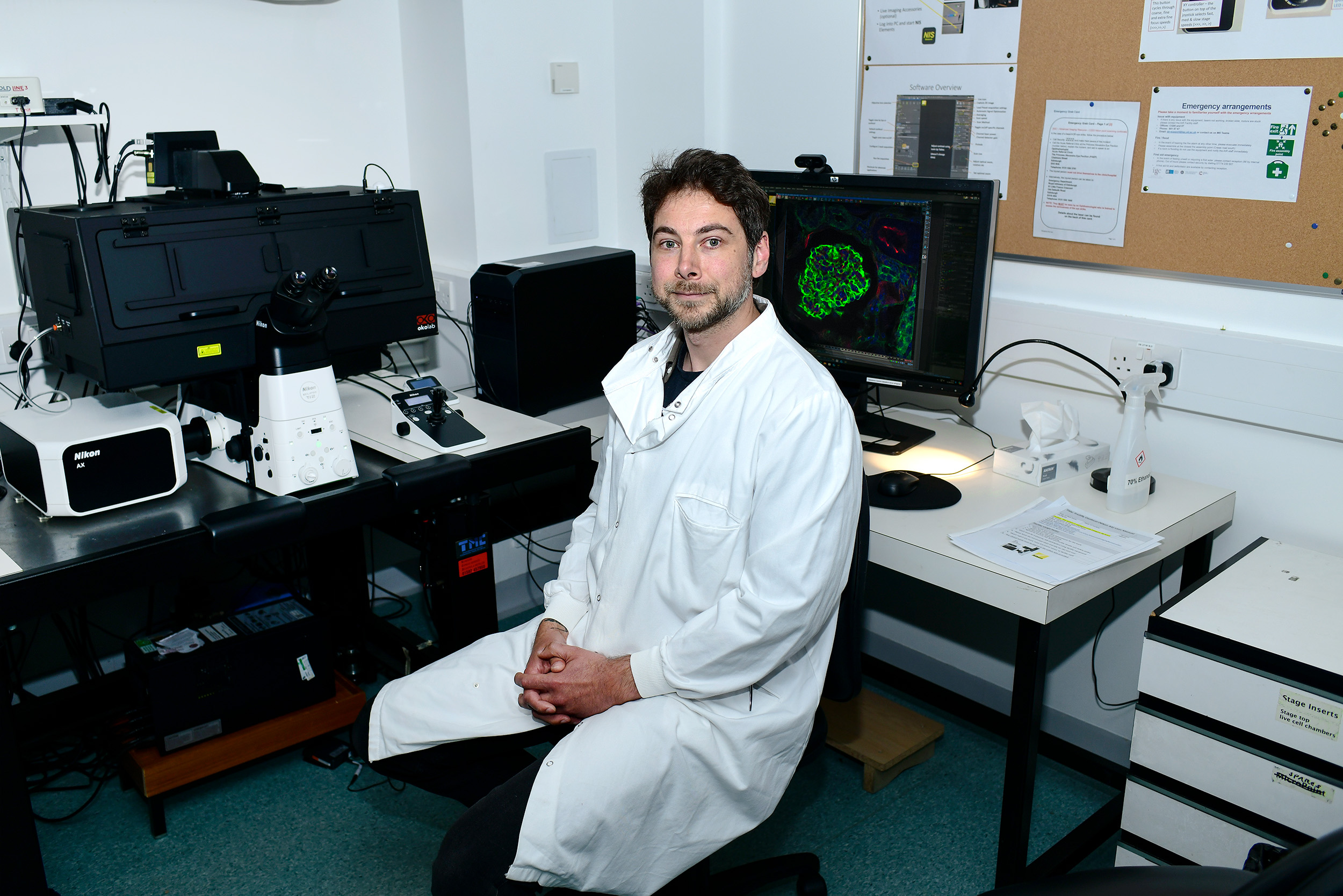 Technician with microscope