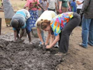 Helen in tie-die t-shirt digging a hole