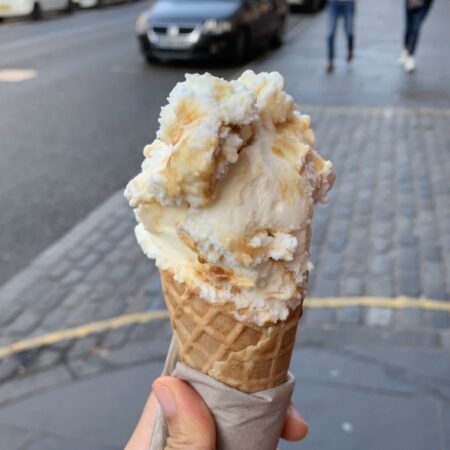 hand holding an ice cream cone.