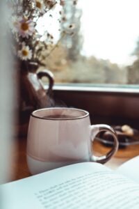 Cup of tea and an open book.