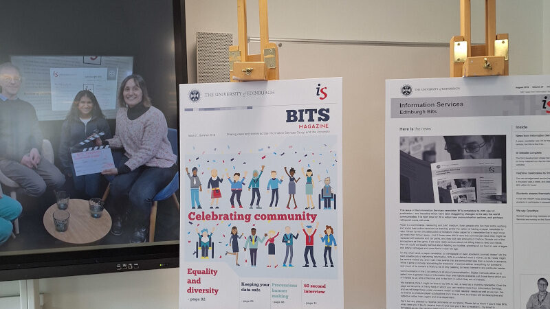 In person launch of the BITs exhibition showing enlarged samples of BITs magazine and some of the team.