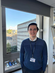 An upper-body photo of Ben in Argyle House.