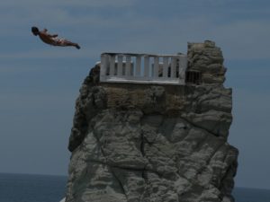 Man cliff diving