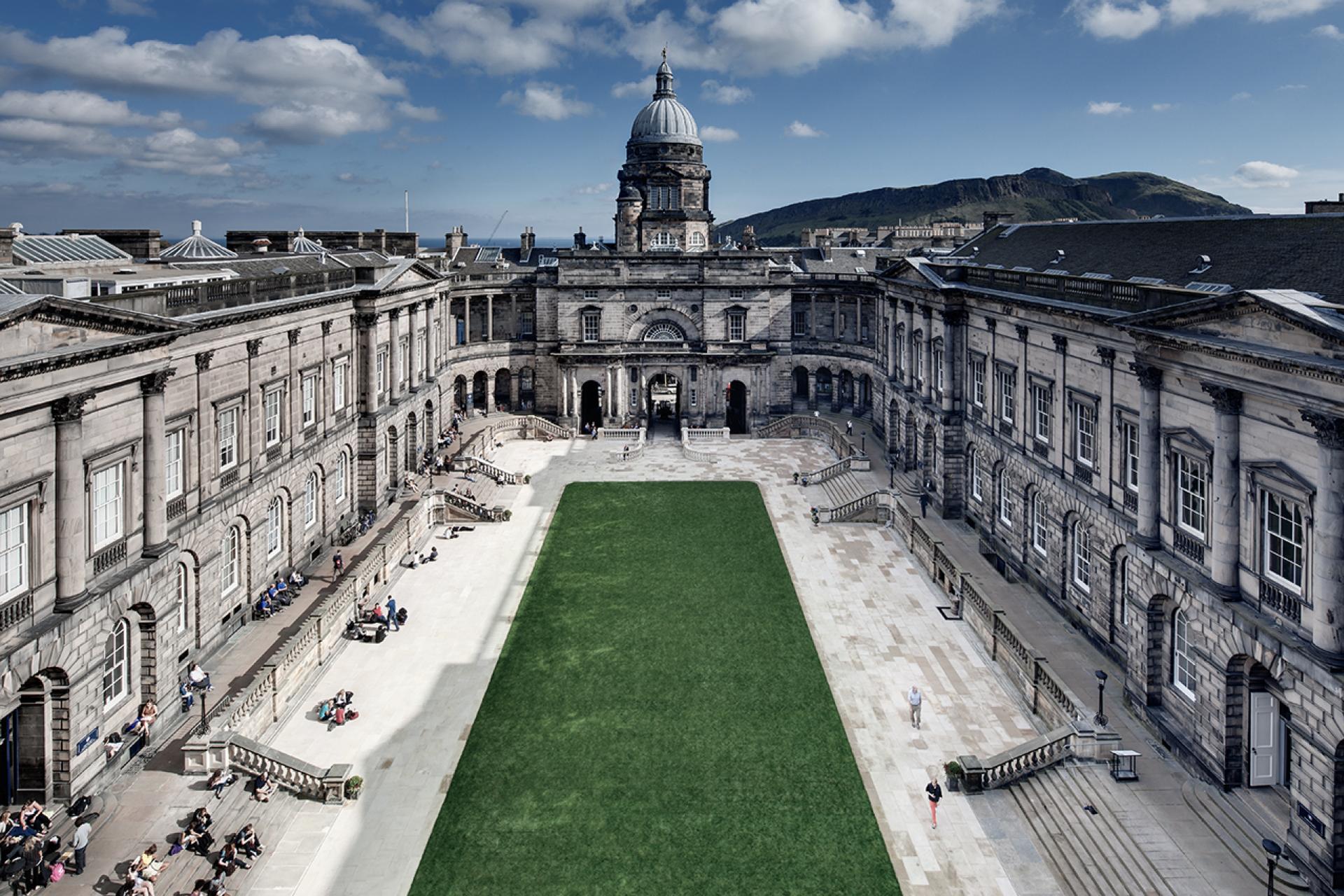 Full view of the Old College in Edinburgh. Image shows the grassy quad surrounded by stone buildings in the sunshine.
