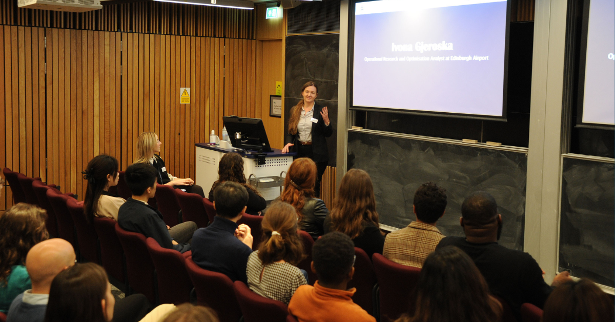 MSc Operational Research graduate Ivona, presents to an audience in a lecture theatre