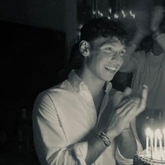 Black and white photo of Salva with birthday cake candles