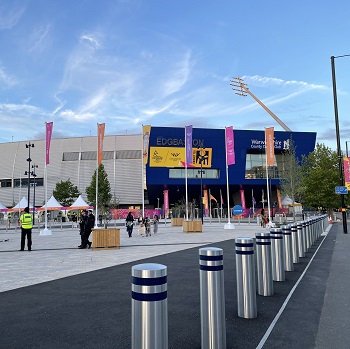 Edgebaston stadium exterior with colourful flags and blue sky