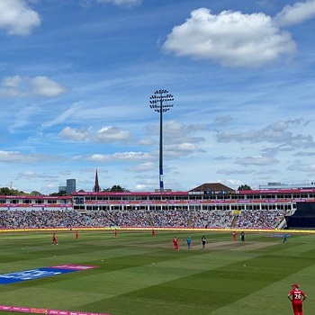 Edgebaston stadium with blue sky in background as cricket game is played