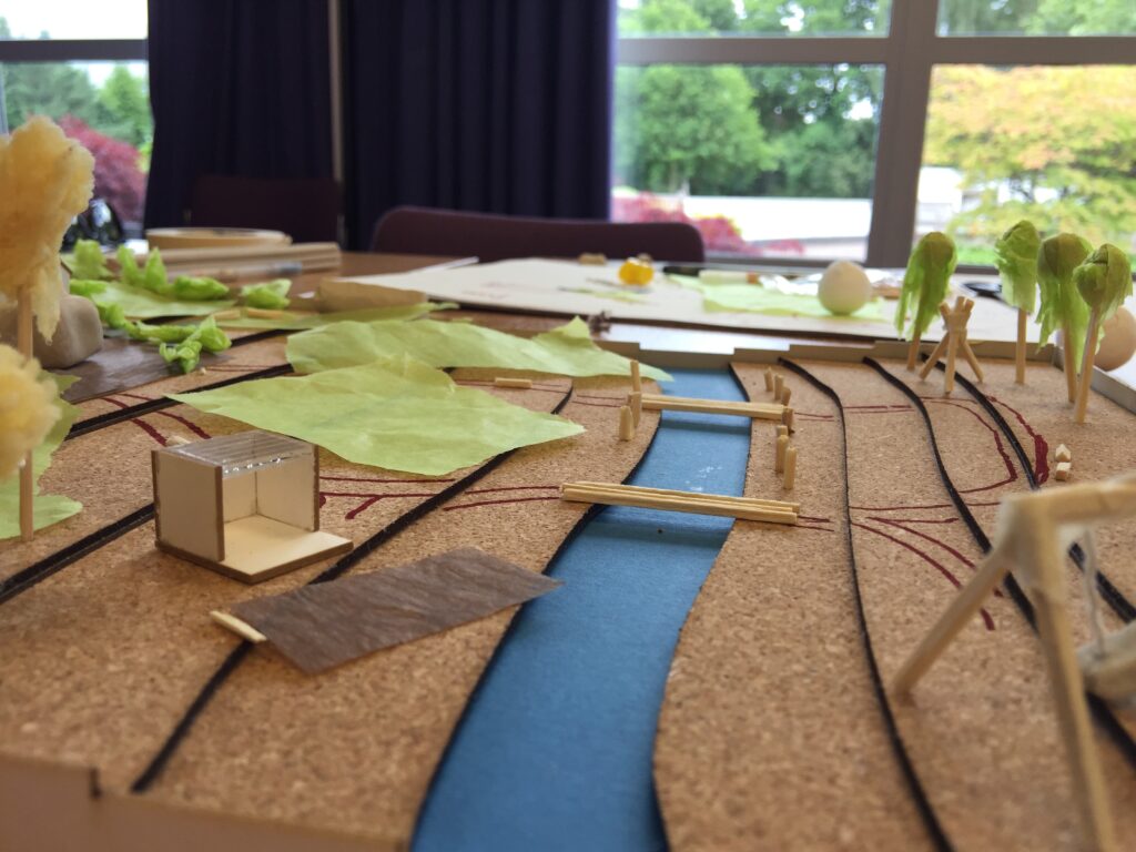 Model of a garden with a river