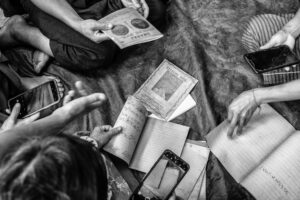 Community members handling notebook replicas