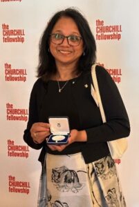 Leah Macaden is pictured at the Churchill Fellowship Award Ceremony in London and poses with her award.