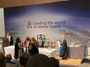 Dr Leah Macaden receiving her award