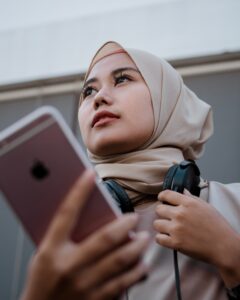 Woman with mobile phone and headphones